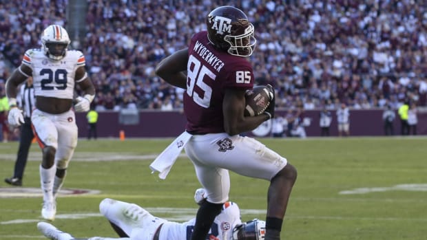 Nov 6, 2021; College Station, Texas, USA; Texas A&M Aggies tight end Jalen Wydermyer (85) breaks the tackle of Auburn Tigers cornerback Roger McCreary (23) in the fourth quarter at Kyle Field. Texas A&M Aggies won 20 to 3.