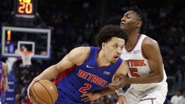 Mar 27, 2022; Detroit, Michigan, USA; Detroit Pistons guard Cade Cunningham (2) dribbles defended by New York Knicks guard Immanuel Quickley (5) in the second half at Little Caesars Arena. Mandatory Credit: Rick Osentoski-USA TODAY Sports