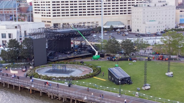 Mar 29, 2022; New Orleans, LA, USA; Detailed view of crews setting up for the NCAA March Madness Music Festival in Woldenberg Park in the French Quarter in New Orleans, La. Mandatory Credit: Stephen Lew-USA TODAY Sports