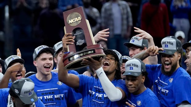 Duke players celebrate after defeating Arkansas in a college basketball game in the Elite 8 round of the NCAA men’s tournament in San Francisco, Saturday, March 26, 2022.
