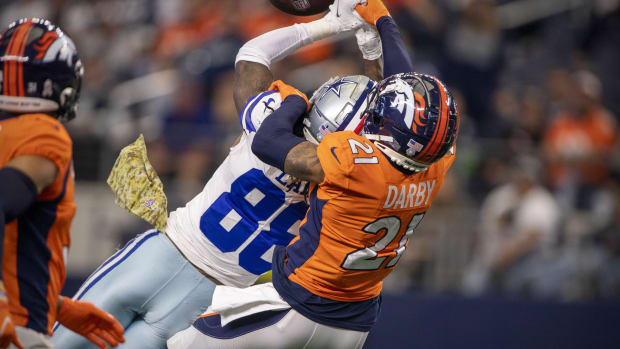 Denver Broncos cornerback Ronald Darby (21) breaks up a pass intended for Dallas Cowboys wide receiver CeeDee Lamb (88) during the second half at AT&T Stadium.