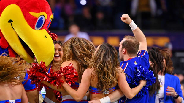 Apr 2, 2022; New Orleans, LA, USA; The Kansas Jayhawks mascot celebrate their win against the Villanova Wildcats with the cheerleaders after the game during the 2022 NCAA men's basketball tournament Final Four semifinals at Caesars Superdome. Mandatory Credit: Bob Donnan-USA TODAY Sports