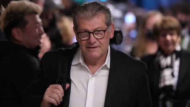 UConn coach Geno Auriemma looks on.