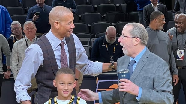 Reggie Miller and his son Ryker with Pacers public relations director David Benner