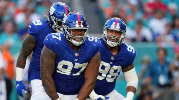 Dec 5, 2021; Miami Gardens, Florida, USA; New York Giants defensive tackle Dexter Lawrence (97) celebrates his tackle of Miami Dolphins running back Salvon Ahmed (not pictured) during the second half at Hard Rock Stadium.