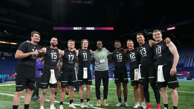 Mar 3, 2022; Indianapolis, IN, USA; Nevada quarterback Carson Staterong (QB14), Kansas State quarterback Skylar Thompson (QB15), Western Kentucky quarterback Bailey Zappe (QB17), Pittsburgh quarterback Kenny Pickett (QB11), Liberty quarterback Malik Willis (QB16), Iowa State quarterback Brock Purdy (QB12), Cincinnati quarterback Desmond Ridder (QB13) and Brown quarterback E J Perry (QB10) pose during the NFL Scouting Combine at Lucas Oil Stadium. Mandatory Credit: Kirby Lee-USA TODAY Sports