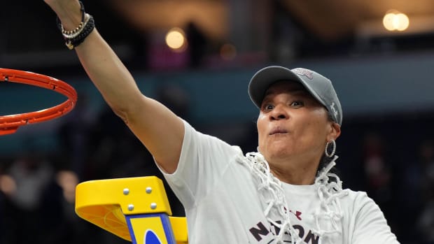 Apr 3, 2022; Minneapolis, MN, USA; South Carolina Gamecocks head coach Dawn Staley cuts down the net as they celebrate their 64-49 victory over the UConn Huskies in the Final Four championship game of the women's college basketball NCAA Tournament at Target Center.