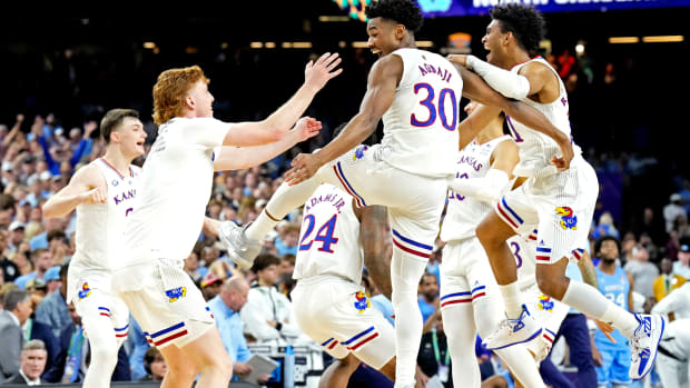 Apr 4, 2022; New Orleans, LA, USA; The Kansas Jayhawks celebrate after beating the North Carolina Tar Heels during the 2022 NCAA men's basketball tournament Final Four championship game at Caesars Superdome. Mandatory Credit: Robert Deutsch-USA TODAY Sports