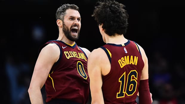Cleveland Cavaliers forward Kevin Love (0) celebrates with forward Cedi Osman (16) after a three point basket.