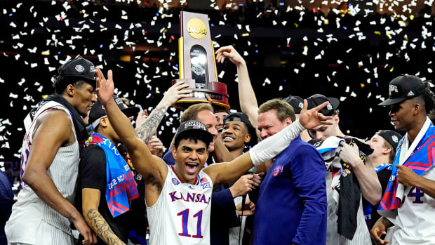 The Kansas Jayhawks celebrate after beating the North Carolina Tar Heels during the 2022 NCAA men’s basketball tournament Final Four championship game at Caesars Superdome.