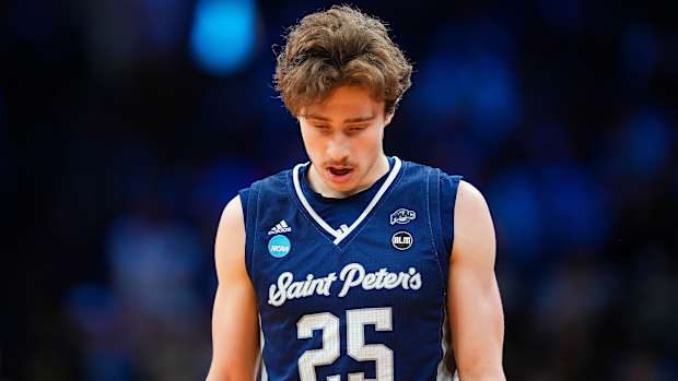 Saint Peter’s guard Doug Edert looks down during a game.