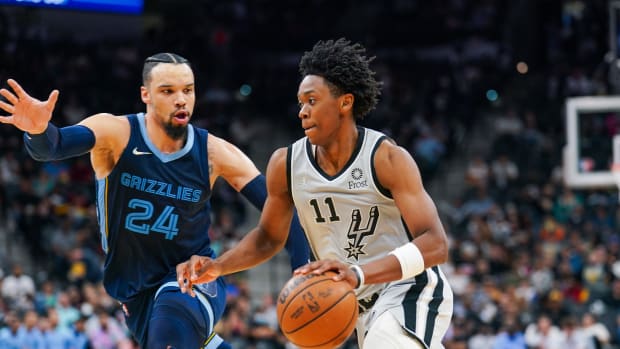 San Antonio Spurs guard Joshua Primo (11) dribbles against Memphis Grizzlies forward Dillon Brooks (24) in the second half at the AT&T Center.