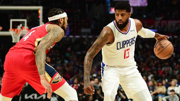 Los Angeles Clippers guard Paul George (13) controls the ball against New Orleans Pelicans forward Brandon Ingram.