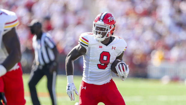 Sep 4, 2021; College Park, Maryland, USA; Maryland Terrapins tight end Chigoziem Okonkwo (9) catches a pass and runs for a touchdown during the first quarter against the West Virginia Mountaineers at Capital One Field at Maryland Stadium.