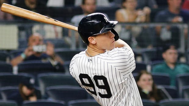 Sep 17, 2021; Bronx, New York, USA; New York Yankees right fielder Aaron Judge (99) hits a solo home run against the Cleveland Indians during the fourth inning at Yankee Stadium.