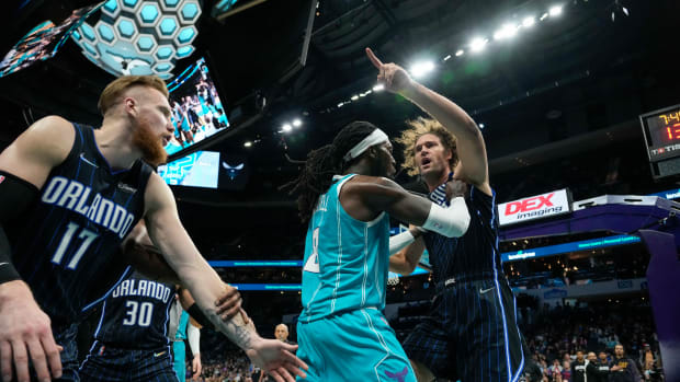 Apr 7, 2022; Charlotte, North Carolina, USA; Charlotte Hornets center Montrezl Harrell (8) tries to clear Orlando Magic center Robin Lopez (right) from an altercation that would later see both players ejected, as well as Magic forward Admiral Schofield (not pictured) during the second half at Spectrum Center.