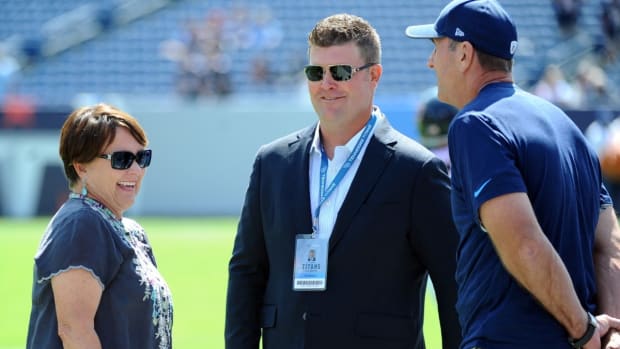 Tennessee Titans controlling owner Amy Adams-Strunk (left) talks with general manager Jon Robinson (center) and head coach Mike Mularkey prior to the preseason game against the Chicago Bears at Nissan Stadium.