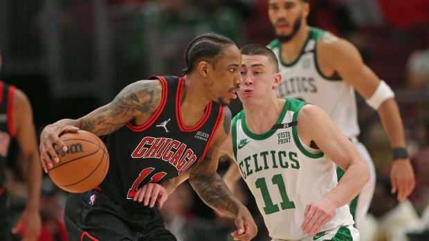 Apr 6, 2022; Chicago, Illinois, USA; Chicago Bulls forward DeMar DeRozan (11) is defended by Boston Celtics guard Payton Pritchard (11) during the first half at the United Center. Mandatory Credit: Dennis Wierzbicki-USA TODAY Sports