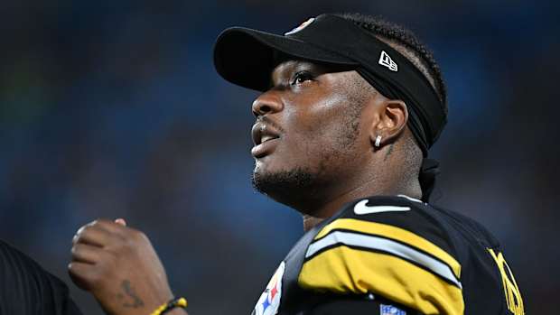 Dwayne Haskins looks on during a game.