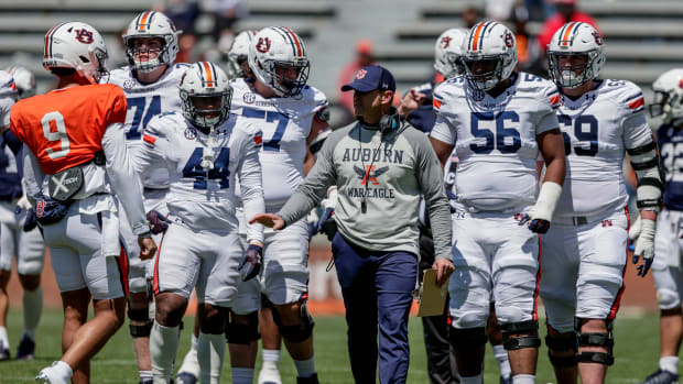 Auburn head coach Bryan Harsin talks with players during the A-Day NCAA college spring football game at Jordan-Hare Stadium, Saturday, April 9, 2022, in Auburn, Ala. (AP Photo/Butch Dill)