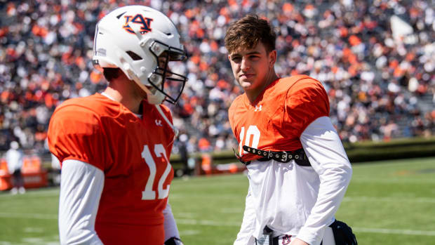 Auburn Tigers quarterback Holden Geriner (12) and Auburn Tigers quarterback Zach Calzada (10) talk on the sideline during the A-Day spring practice at Jordan-Hare Stadium in Auburn, Ala., on Saturday, April 9, 2022.