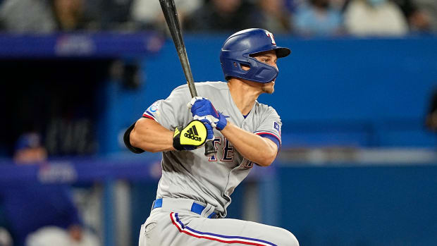 Apr 10, 2022; Toronto, Ontario, CAN; Texas Rangers shortstop Corey Seager (5) hits a single during the eighth inning against the Texas Rangers at Rogers Centre. Mandatory Credit: John E. Sokolowski-USA TODAY Sports