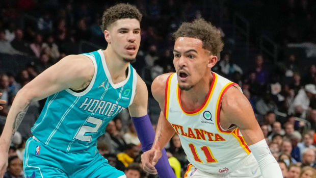 Atlanta Hawks guard Trae Young (11) drives to the basket defended by Charlotte Hornets guard LaMelo Ball (2) during the first quarter at the Spectrum Center.