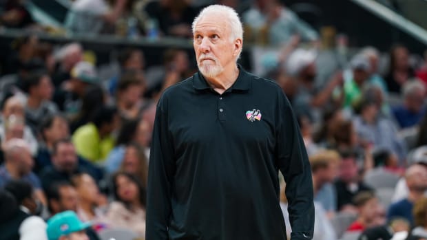 Spurs coach Gregg Popovich looks on during a game.