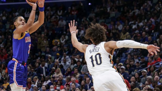 Apr 10, 2022; New Orleans, Louisiana, USA; Golden State Warriors guard Jordan Poole (3) shoots a jump shot against New Orleans Pelicans center Jaxson Hayes (10) during the first half at the Smoothie King Center. Mandatory Credit: Stephen Lew-USA TODAY Sports