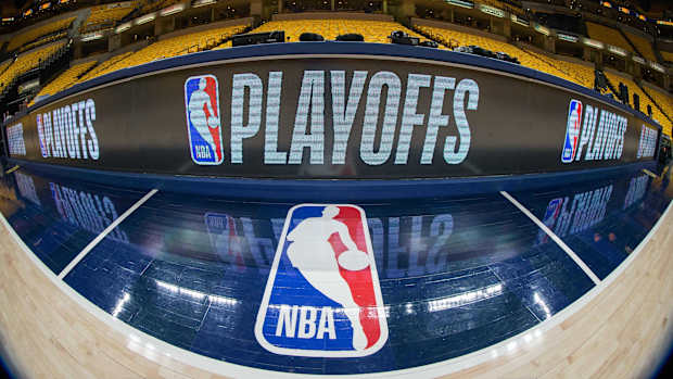A general view of the NBA logo and the playoffs scorer table.