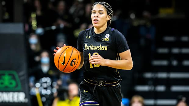 Point guard Veronica Burton dribbles the ball during a game.
