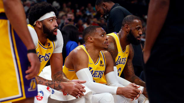 Anthony Davis (left), Russell Westbrook (middle), and LeBron James (right) on the Lakers bench.