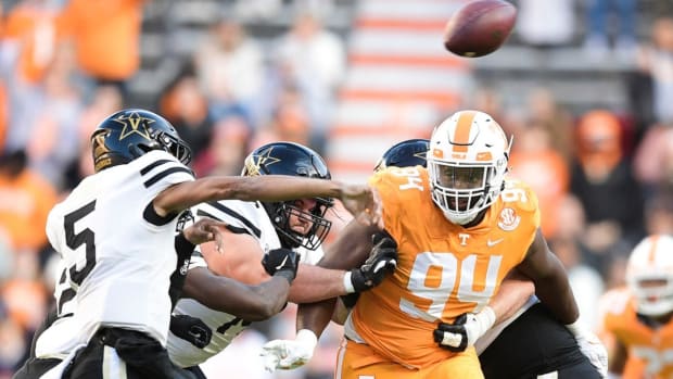 Tennessee defensive lineman Matthew Butler (94) breaks past the offensive line towards Vanderbilt quarterback Mike Wright (5) during an SEC conference game between Tennessee and Vanderbilt at Neyland Stadium in Knoxville, Tenn. on Saturday, Nov. 27, 2021.