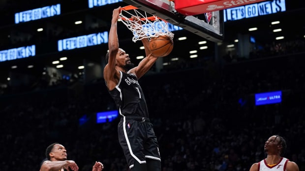 Brooklyn Nets’ Kevin Durant dunks the ball during the second half of the opening basketball game of the NBA play-in tournament against the Cleveland Cavaliers, Tuesday, April 12, 2022, in New York.
