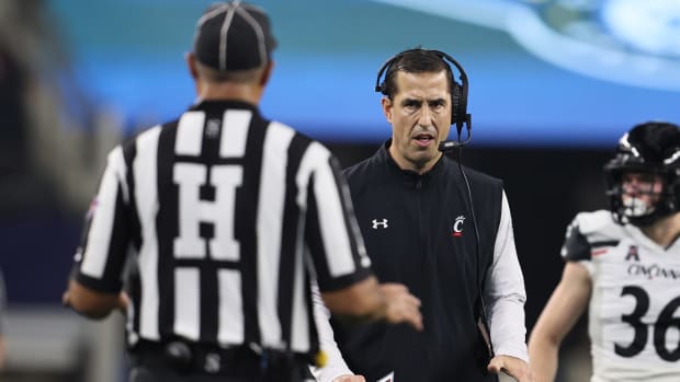 Dec 31, 2021; Arlington, Texas, USA; Cincinnati Bearcats head coach Luke Fickell argues a call during the game against the the Alabama Crimson Tide during the 2021 Cotton Bowl college football CFP national semifinal game at AT&T Stadium. Mandatory Credit: Matthew Emmons-USA TODAY Sports