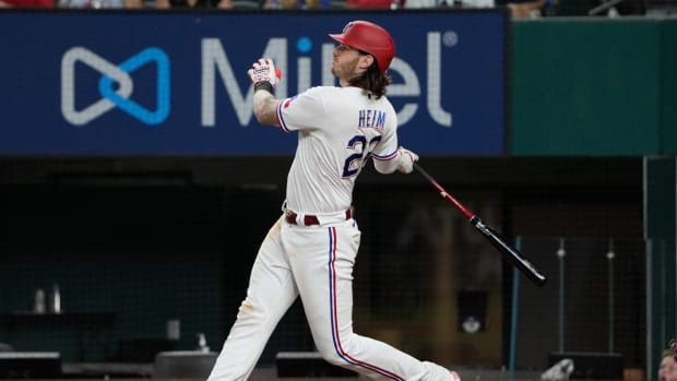 Oct 2, 2021; Arlington, Texas, USA; Texas Rangers catcher Jonah Heim (28) follows through on his three-run home run against the Cleveland Indians during the fourth inning at Globe Life Field. Mandatory Credit: Jim Cowsert-USA TODAY Sports