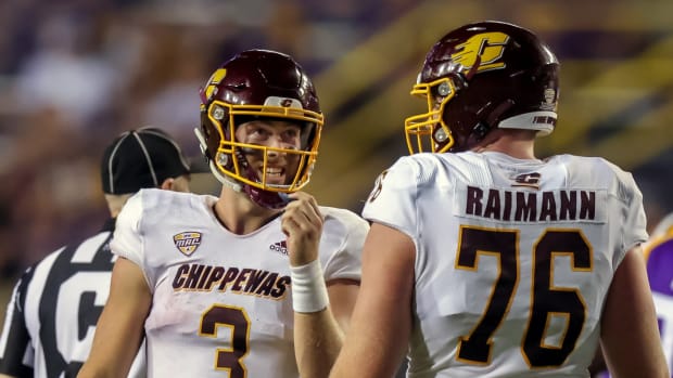 Central Michigan Chippewas quarterback Jacob Sirmon (3) and Central Michigan Chippewas offensive lineman Bernhard Raimann (76) react after a sack by LSU Tigers linebacker Jarell Cherry (not pictured) during the second half at Tiger Stadium.