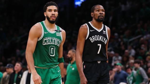 Boston Celtics forward Jayson Tatum (0) and Brooklyn Nets forward Kevin Durant.