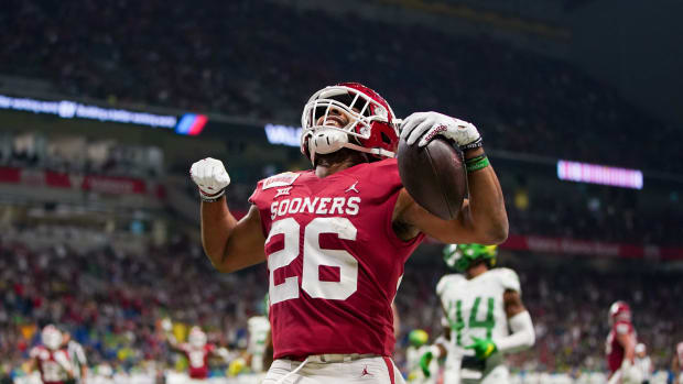 Dec 29, 2021; San Antonio, Texas, USA; Oklahoma Sooners running back Kennedy Brooks (26) celebrates a touchdown in the first quarter against the Oregon Ducks during the 2021 Alamo Bowl at the Alamodome. Mandatory Credit: Daniel Dunn-USA TODAY Sports