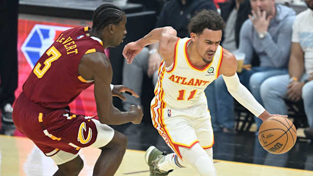 Atlanta Hawks guard Trae Young (11) drives against Cleveland Cavaliers guard Caris LeVert (3) in the first quarter at Rocket Mortgage FieldHouse.