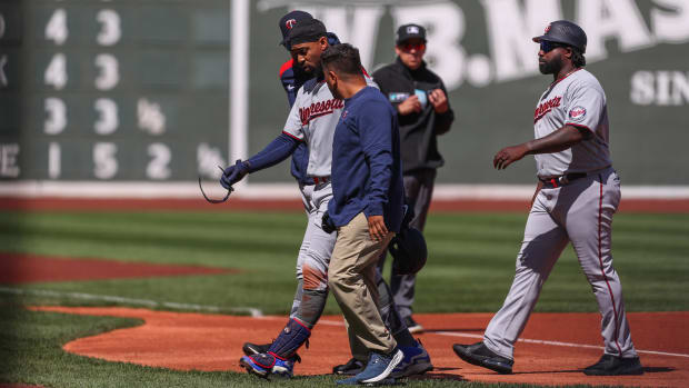 Apr 15, 2022; Boston, Massachusetts, USA; Minnesota Twins center fielder Byron Buxton (25) reacts during the first inning after getting injured against the Boston Red Sox at Fenway Park. Every player is wearing number 42 in honor of Jackie Robinson.