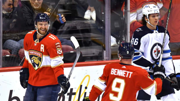 Apr 15, 2022; Sunrise, Florida, USA; Florida Panthers left wing Jonathan Huberdeau (11) celebrates his second goal of the first period with teammate center Sam Bennett (9) against the Winnipeg Jets at FLA Live Arena. Mandatory Credit: Jim Rassol-USA TODAY Sports