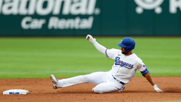 Apr 16, 2022; Arlington, Texas, USA; Texas Rangers second baseman Marcus Semien (2) doubles to drive in a run against the Los Angeles Angels during the third inning at Globe Life Field. Mandatory Credit: Andrew Dieb-USA TODAY Sports