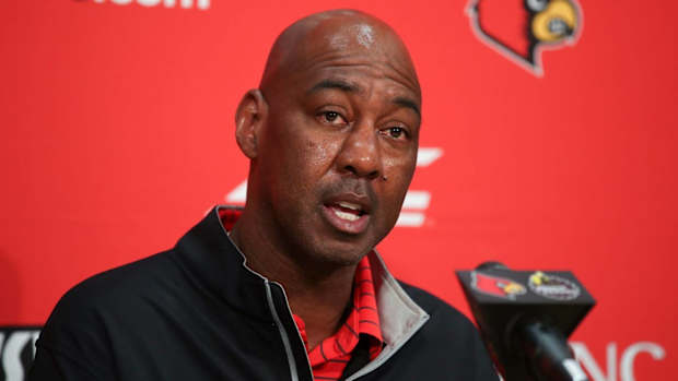 Danny Manning speaks to media at a Louisville press conference.