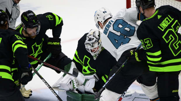 Apr 16, 2022; Dallas, Texas, USA; Dallas Stars goaltender Jake Oettinger (29) makes a glove save as San Jose Sharks center Tomas Hertl (48) looks for the rebound during the third period at the American Airlines Center. Mandatory Credit: Jerome Miron-USA TODAY Sports