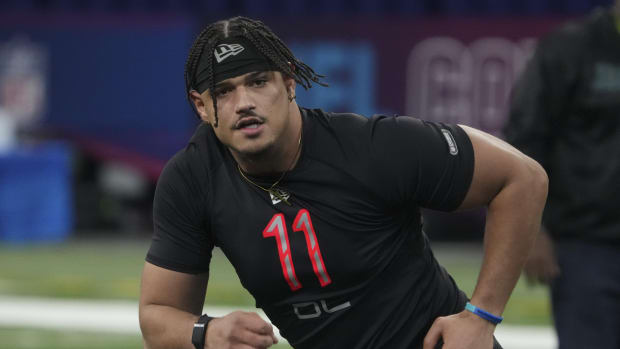 Mar 5, 2022; Indianapolis, IN, USA; Houston defensive lineman Logan Hall (DL11) goes through drills during the 2022 NFL Scouting Combine at Lucas Oil Stadium.