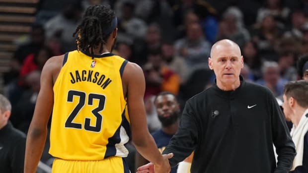 Pacers head coach Rick Carlisle high fives rookie center Isaiah Jackson during a timeout.