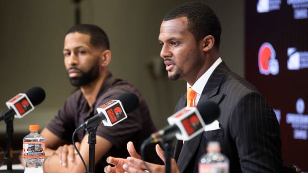 Cleveland Browns quarterback Deshaun Watson, right, talks with the media as general manager Andrew Berry listens during a press conference at the CrossCountry Mortgage Campus.