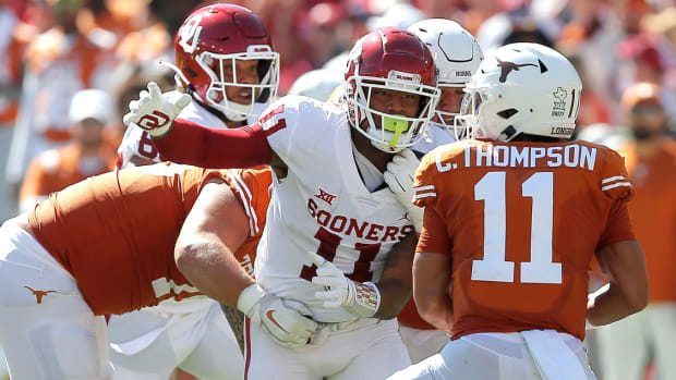 Oklahoma's Nik Bonitto (11) tries to get to Texas' Casey Thompson (11) during the Red River Showdown college football game between the University of Oklahoma Sooners (OU) and the University of Texas (UT) Longhorns at the Cotton Bowl in Dallas, Saturday, Oct. 9, 2021. Oklahoma won 55-48. Ou Vs Texas