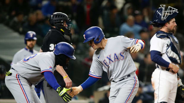 Apr 21, 2022; Seattle, Washington, USA; Texas Rangers right fielder Adolis Garcia (53) greets left fielder Nick Solak (15) after Solak hit a two-run home run against the Seattle Mariners during the fifth inning at T-Mobile Park. Mandatory Credit: Lindsey Wasson-USA TODAY Sports